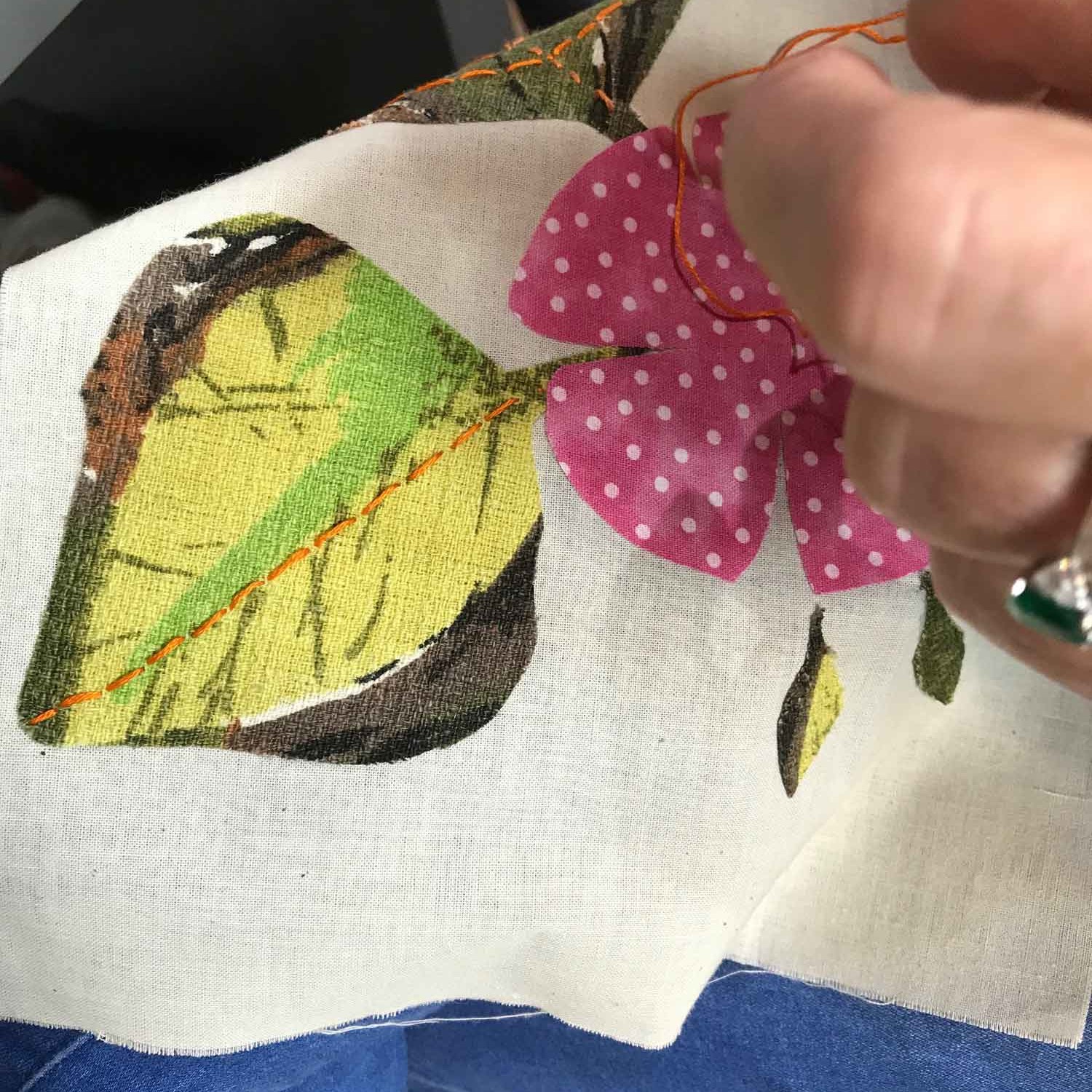 Stitching flowers to hessian