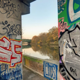 River Lea through panes of graffiti